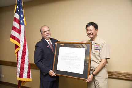Chairperson J. Anthony Poleo swears in Commission member RADM Jonathan A. Yuen, Department of the Navy.